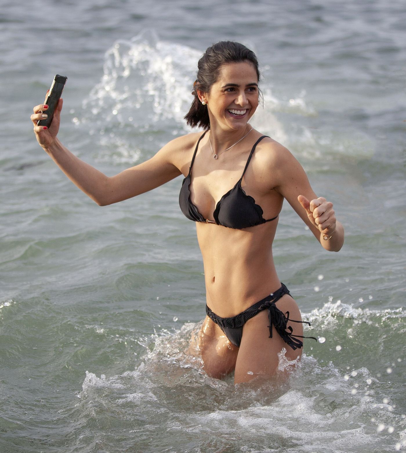 Someone taking a portrait photograph with a smartphone outdoors